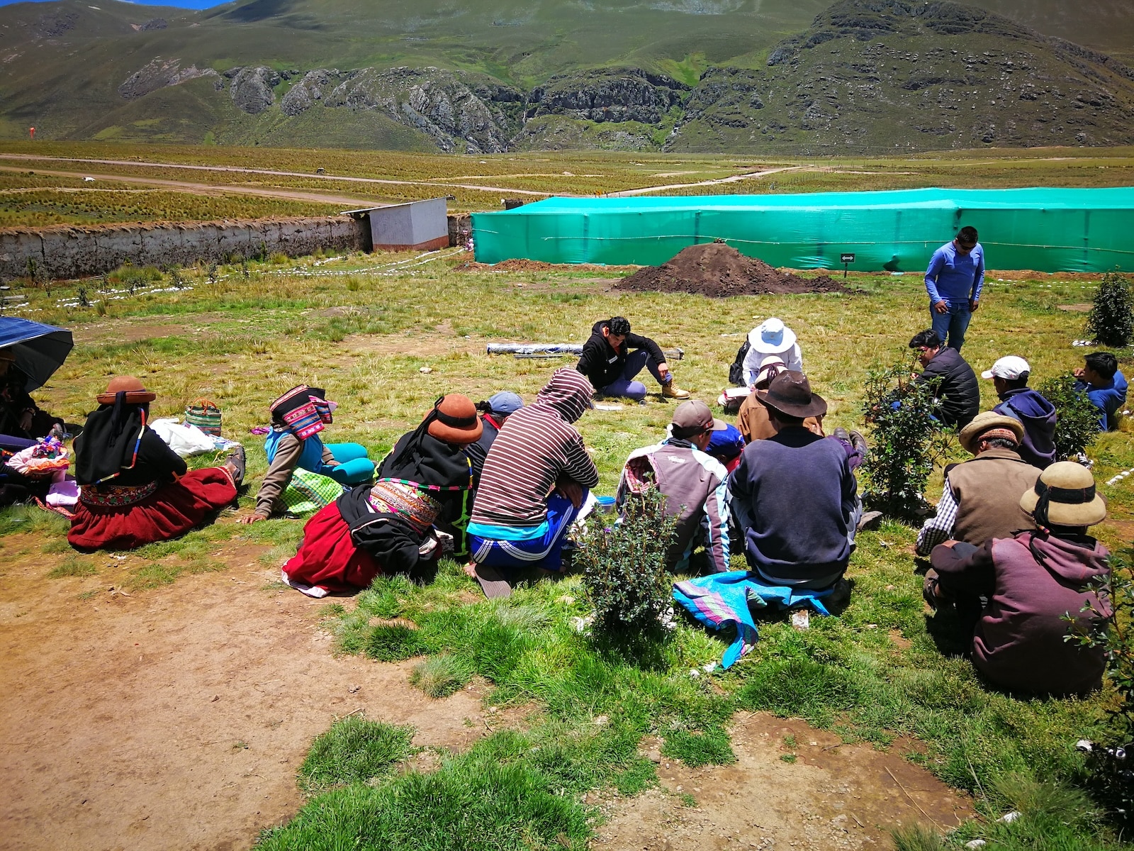 Group of people sitting in a field